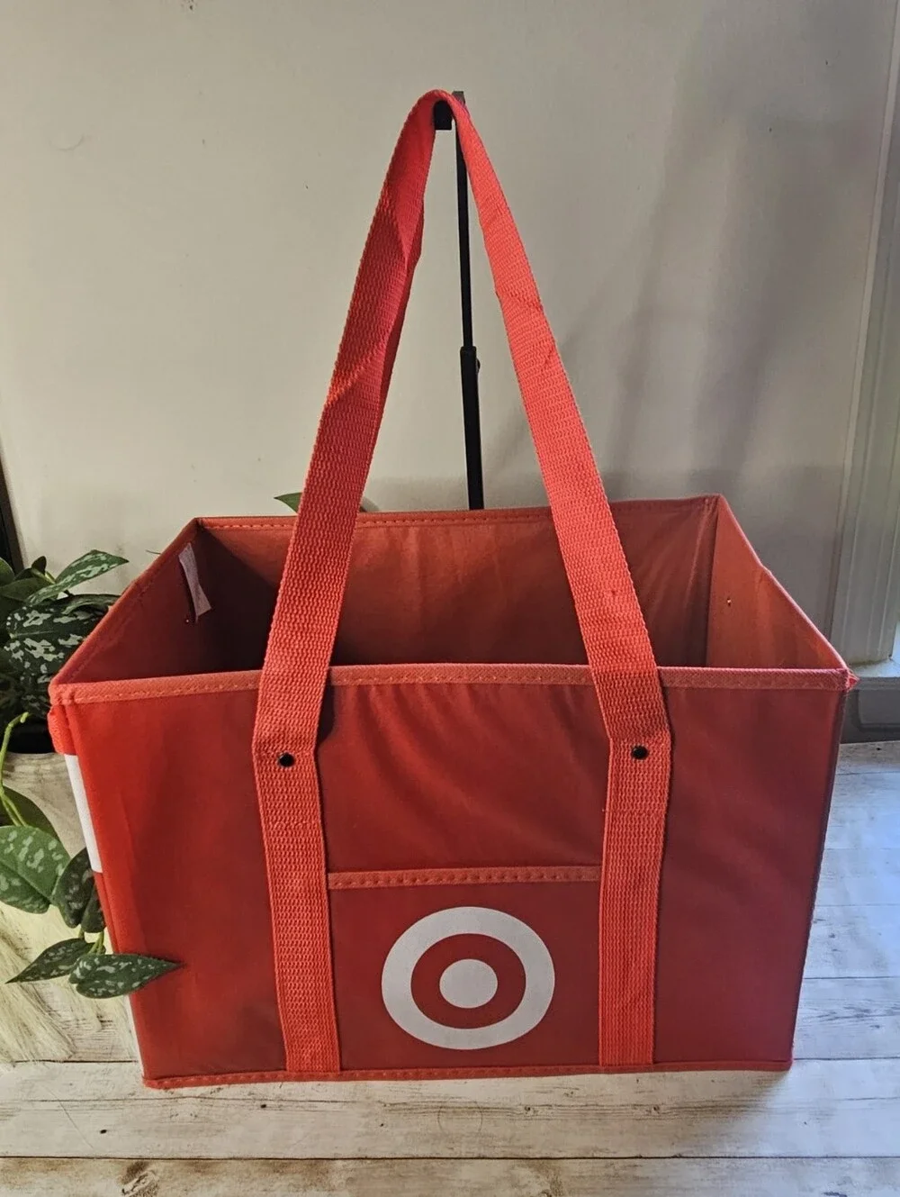 Target red collapsible box-style utility bag. It features a rectangular, boxy sh